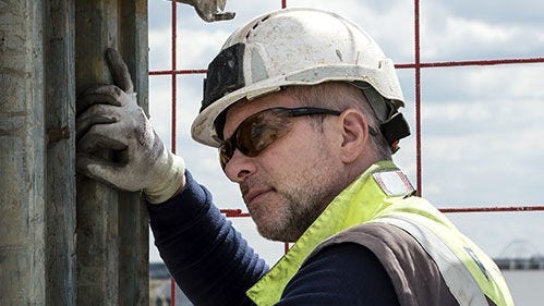 Man with protective helmet and glasses